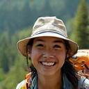 Adventure traveler S. Chen smiling during a trek.